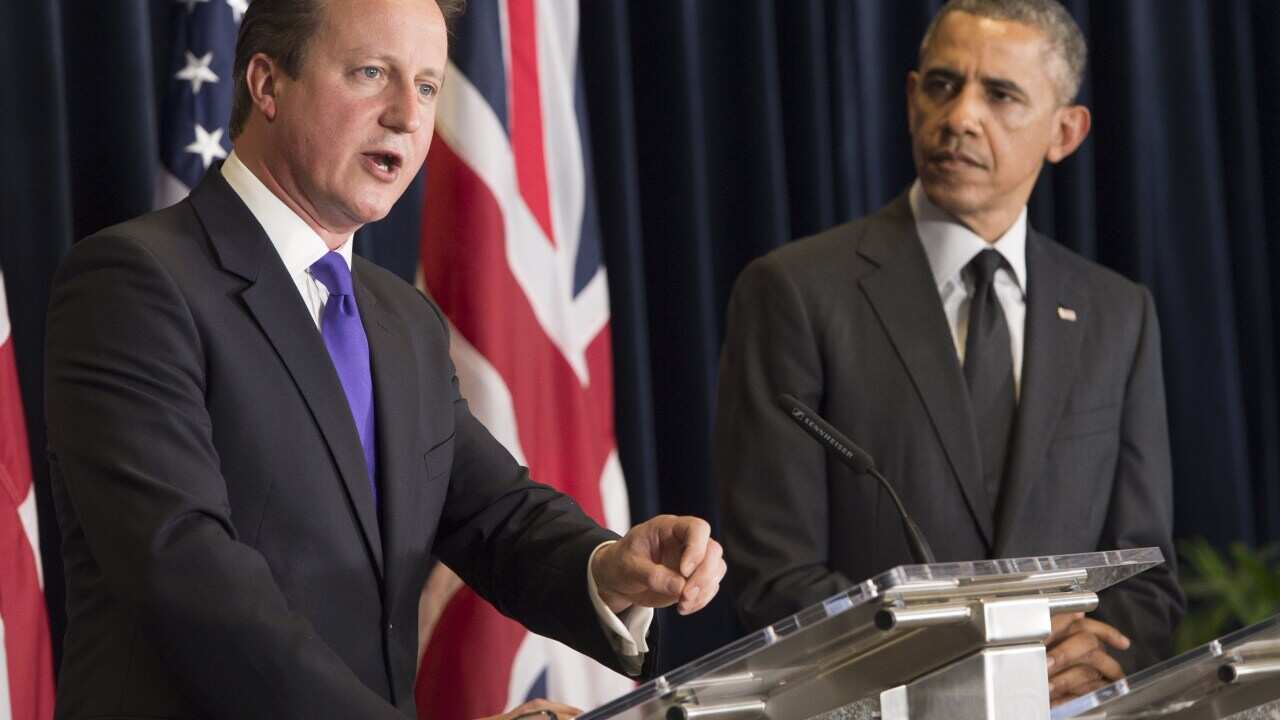 US President Barack Obama (R) and British Prime Minister David Cameron hold a joint press conference during the G7 Summit at the European Council in Brussels, on June 5, 2014. (Getty)