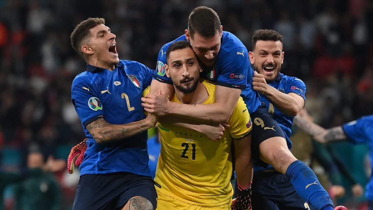 Italy players celebrate with Gianluigi Donnarumma