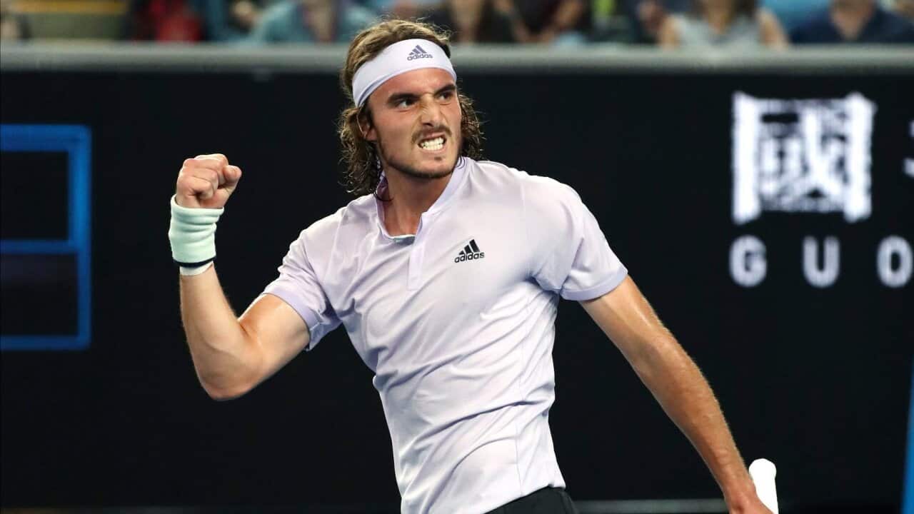 Stefanos Tsitsipas of Greece reacts after defeating Italy's Salvatore Caruso in their first round singles match at the Australian Open tennis championship in Melbourne, Australia, Monday, Jan. 20, 2020. (AP Photo/Dita Alangkara)