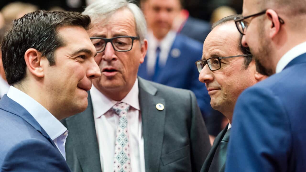 Greek Prime Minister Alexis Tsipras, left, speaks with, from left, European Commission President Jean-Claude Juncker, French President Francois Hollande and Belgian Prime Minister Charles Michel during a meeting of eurozone heads of state