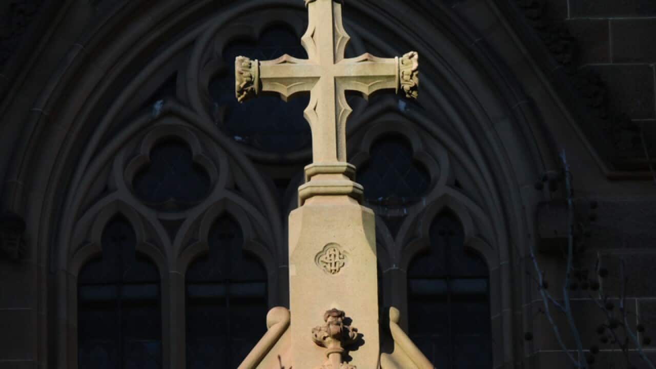 A cross on the exterior of St Mary's Cathedral