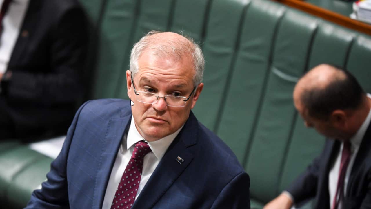 Australian Prime Minister Scott Morrison reacts during Question Time