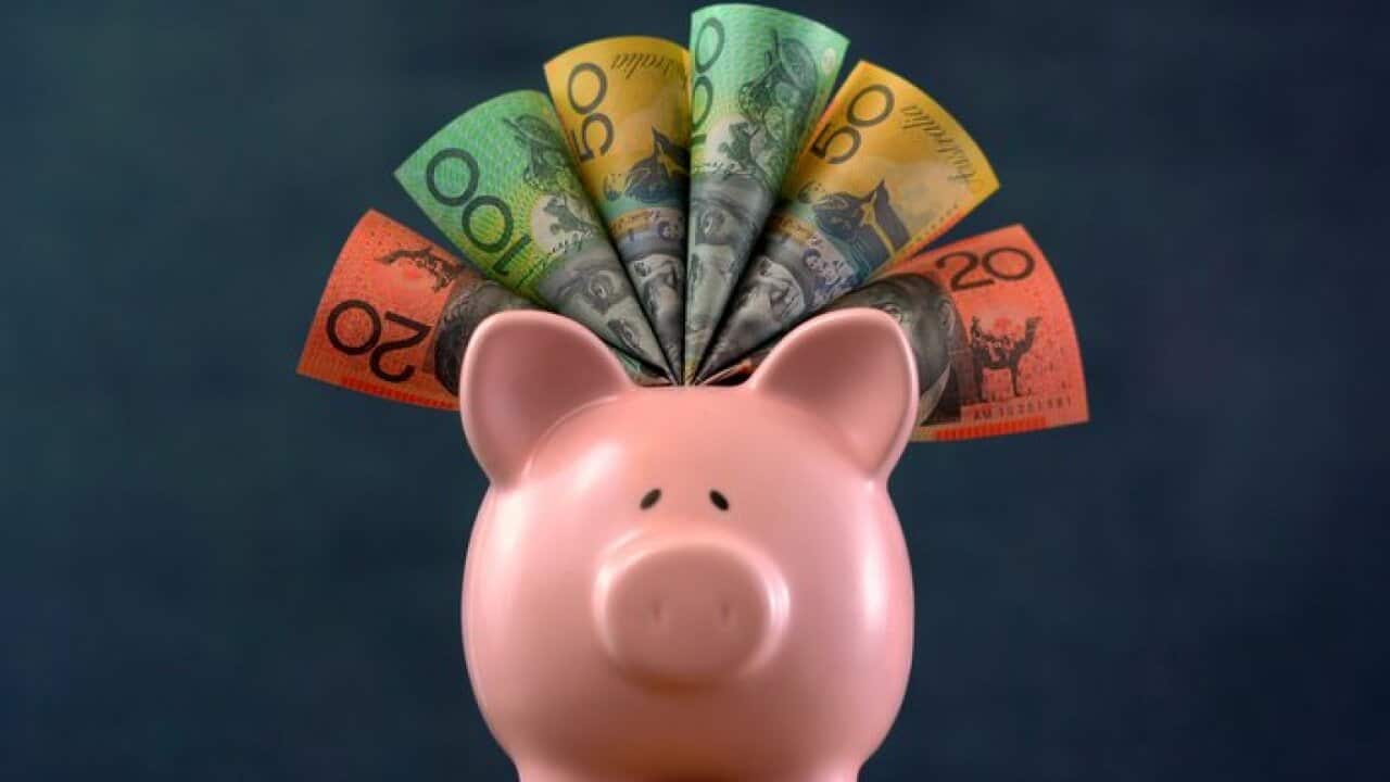 Pink Piggy bank money concept on dark blue background