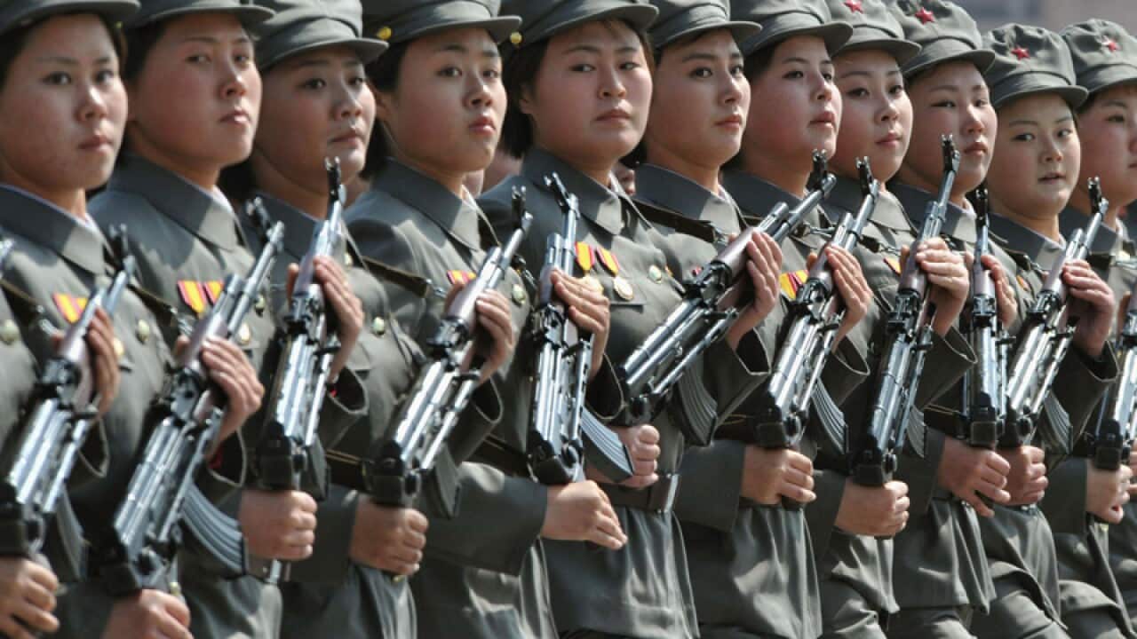 Female members of North Korea's military march in a parade. (AAP)