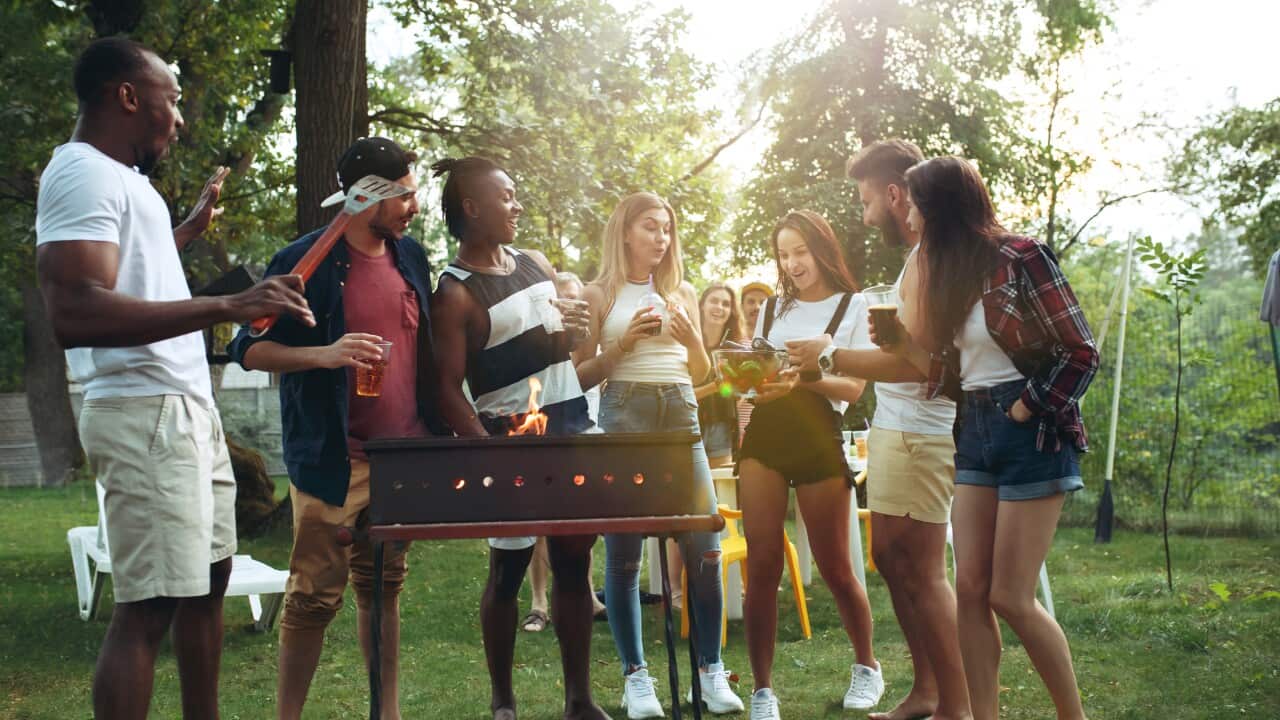Group of friends making barbecue in the backyard. concept about good and positive mood with friends