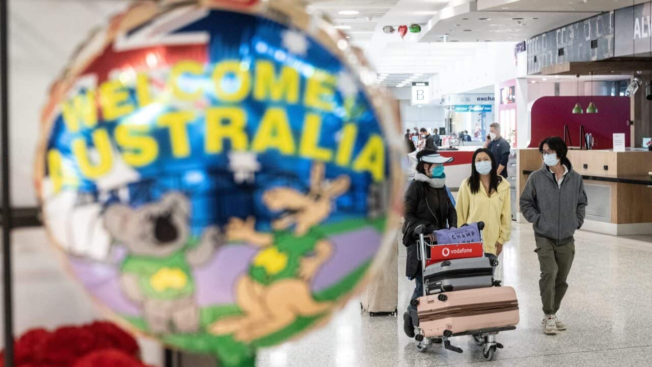 People wearing facemasks at Sydney airport