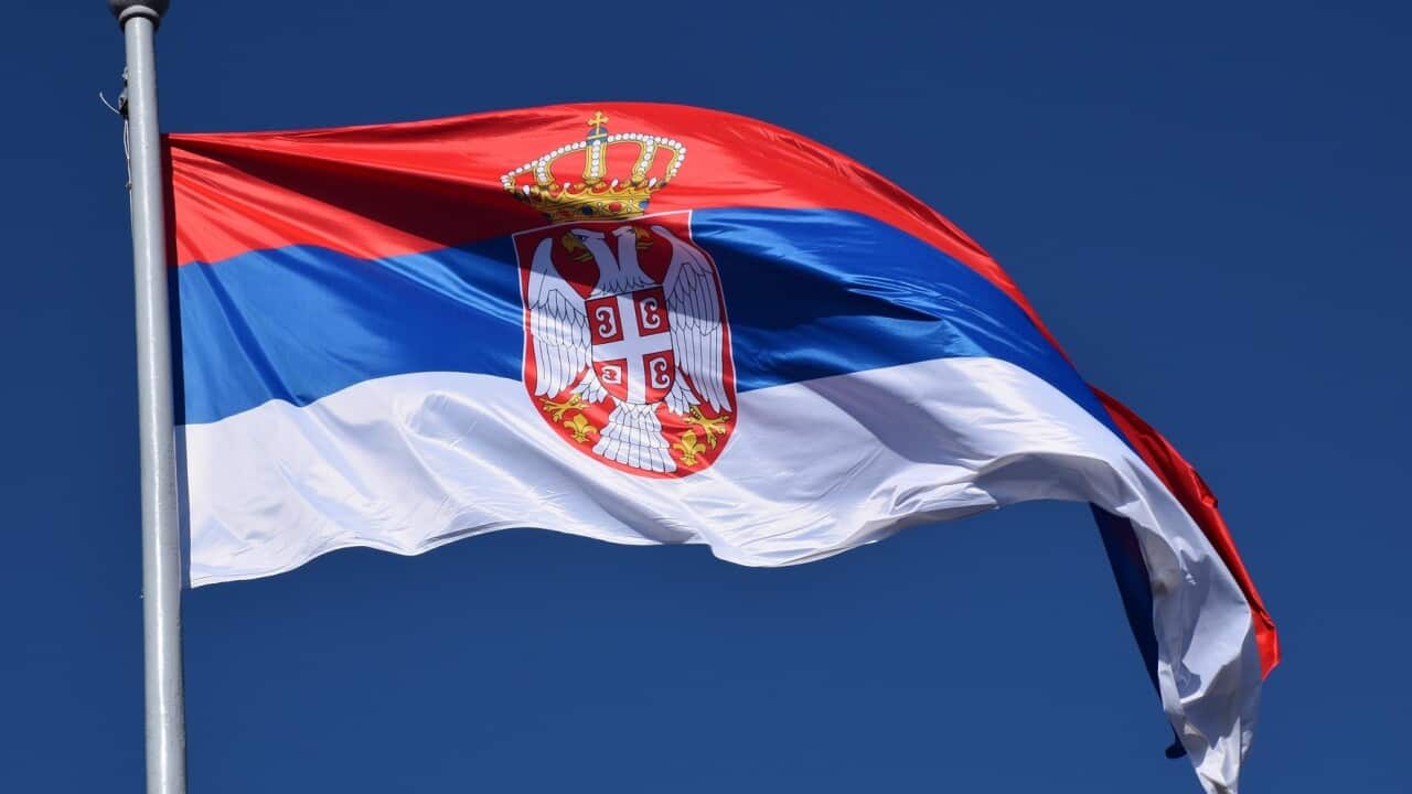 Serbian flag on a pole