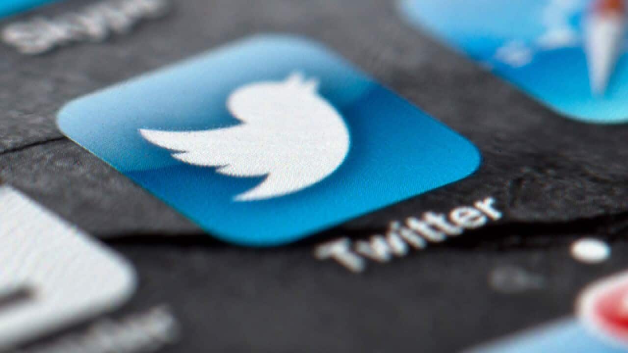 A smartphone display of the Twitter logo