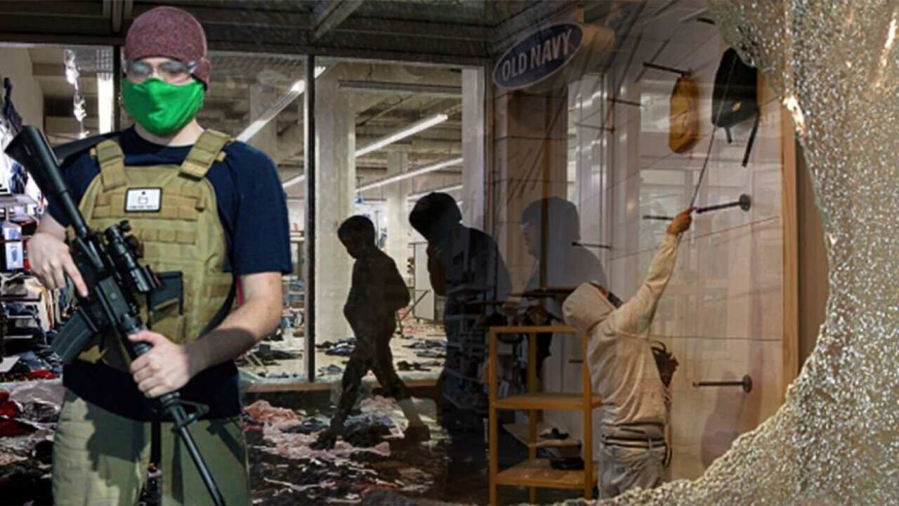 This doctored image showed a man holding a rifle in front of a store with broken windows.