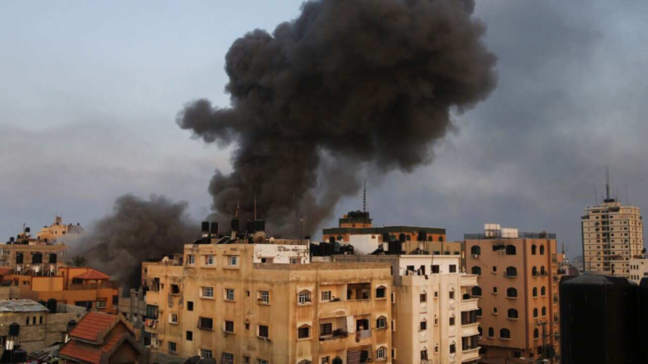 Smoke rises from a building in Gaza City