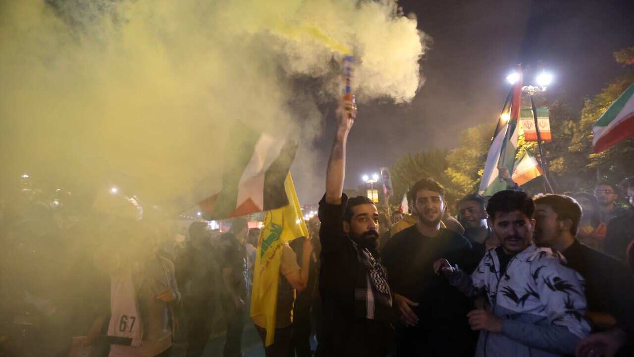 Iranians celebrate following missile attack against Israel
