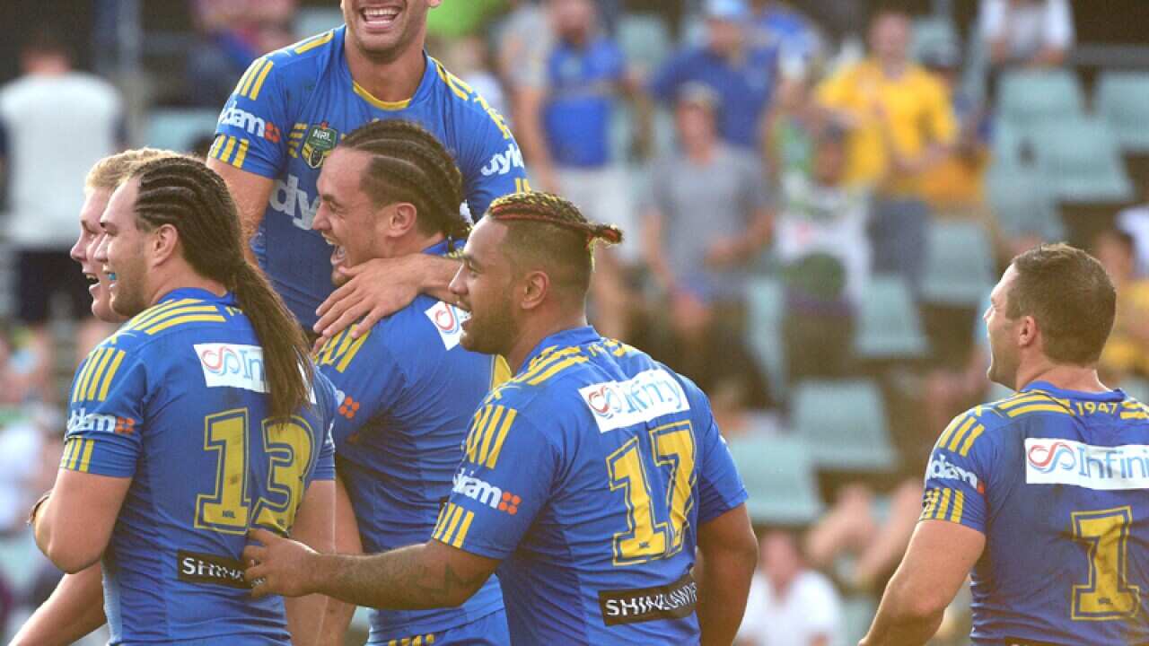 Parramatta Eels players celebrate after scoring a goal