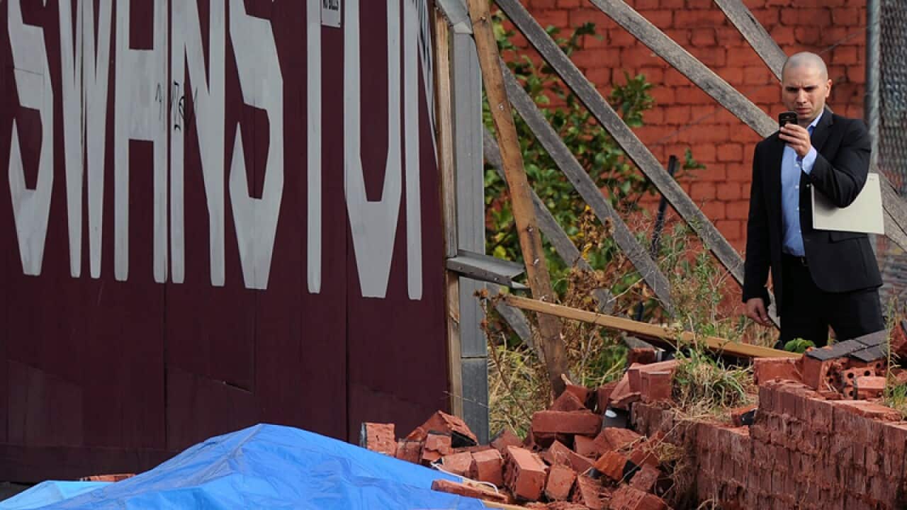 Emergency services at the scene of a wall collapse