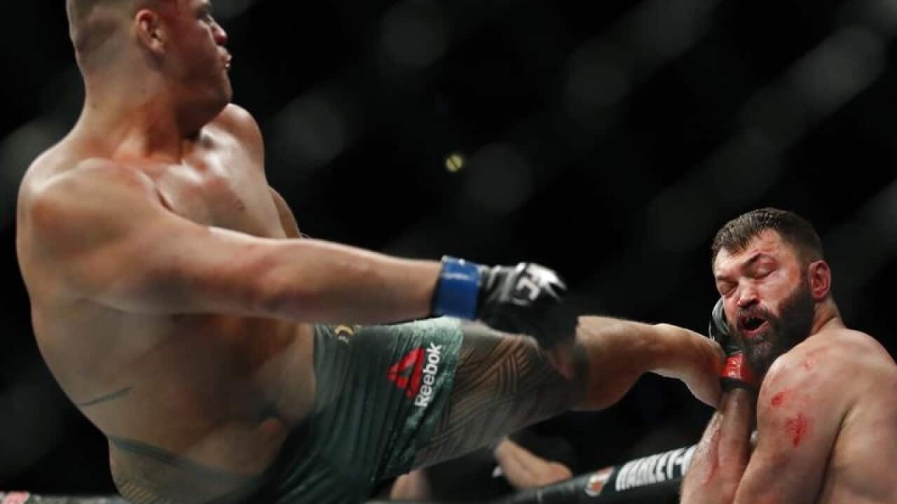 Tai Tuivasa kicks Andrei Arlovski.