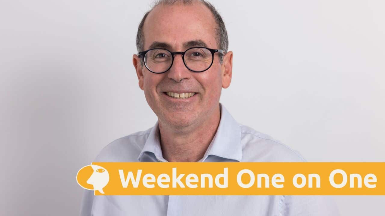 Paul Bassat wearing a light grey shirt.