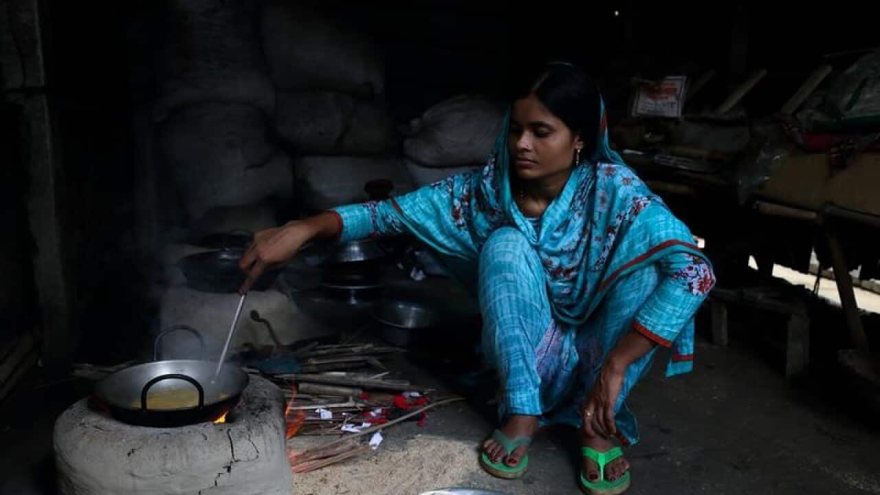 21-year-old, Tania, prepares a meal.