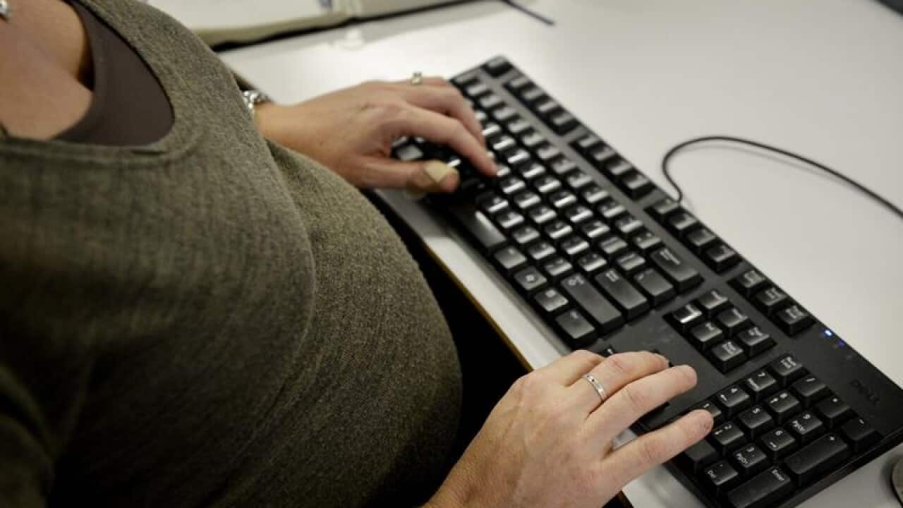 A pregnant woman at work