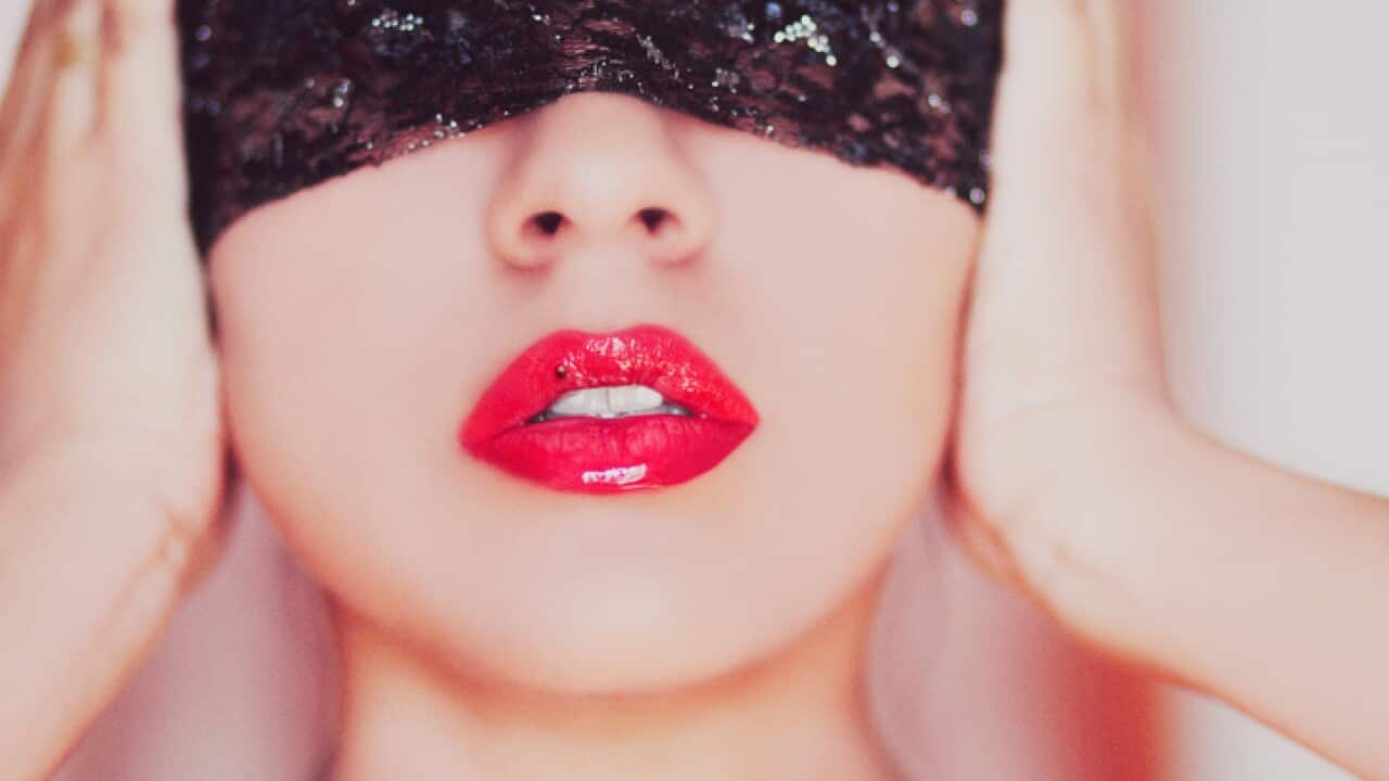 Young woman blindfolded