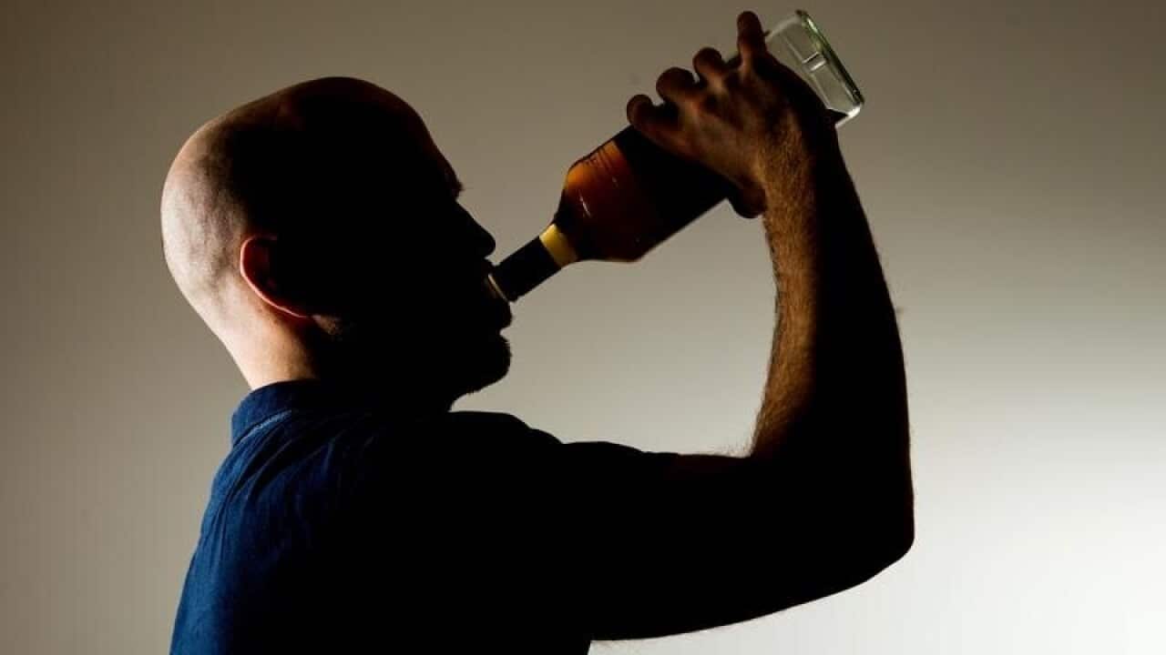 A man drinking alcohol