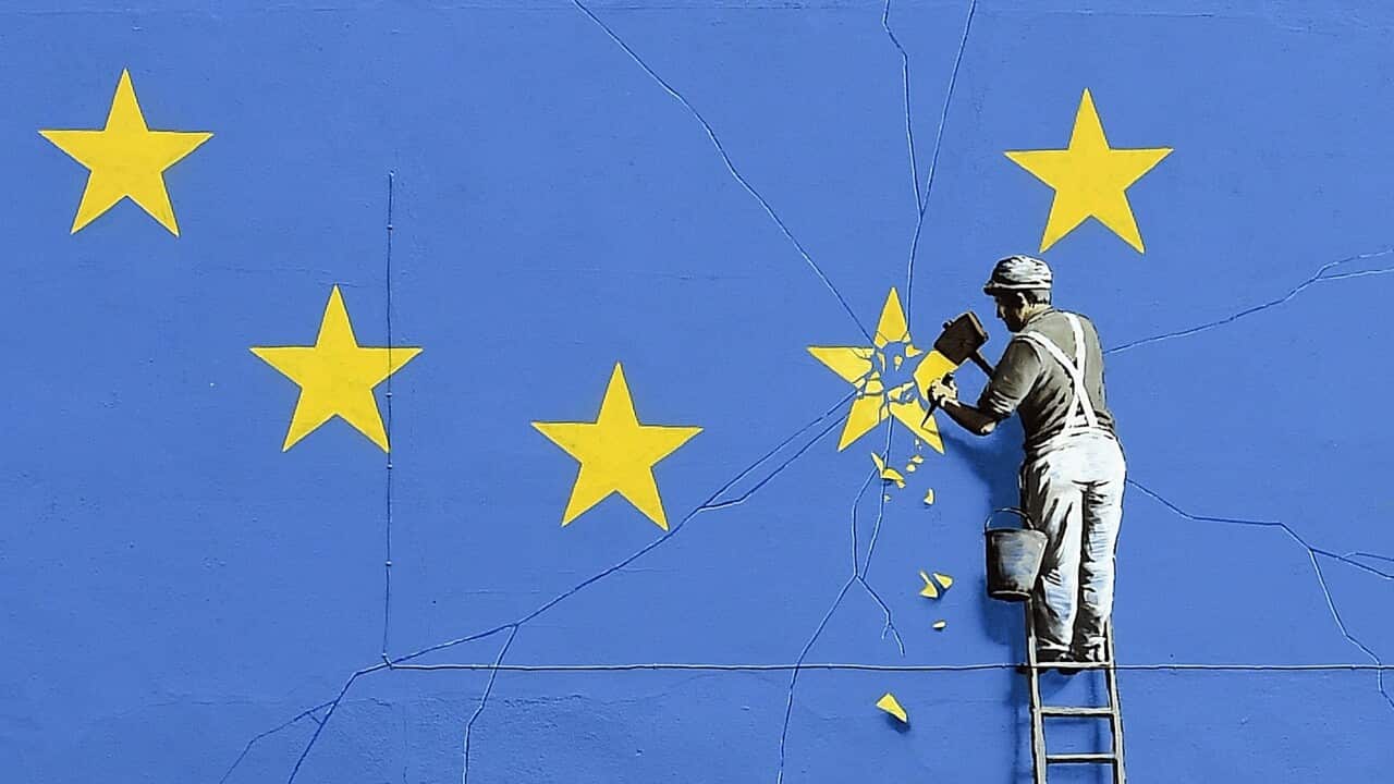 The Brexit-inspired mural by Banksy, showing a worker chipping away at a star on an EU flag.