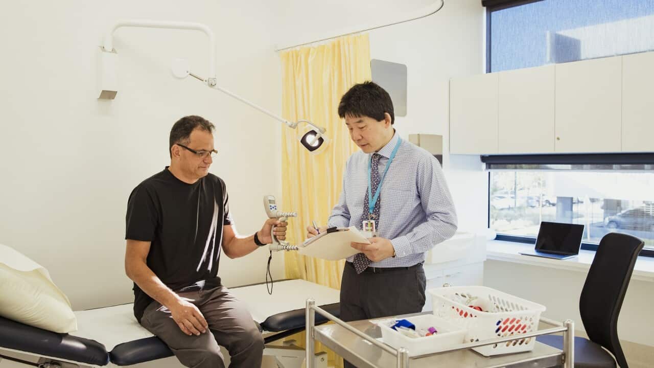 Doctor Recording the Results