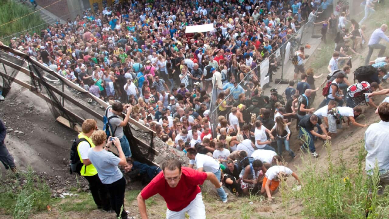 People flee during a mass panic at a techno festival, Germany