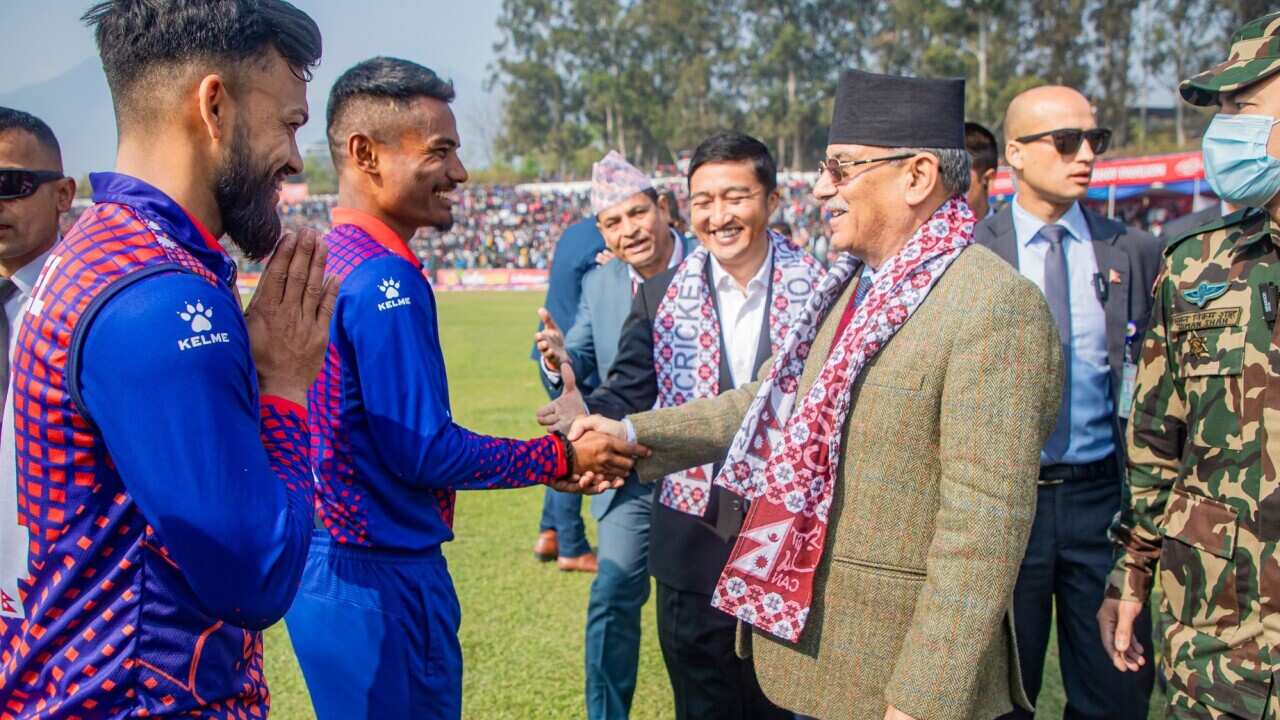 Nepal's Prime Minister Pushpa Kamal Dahal (Prachanda) with national cricket team players at Tribhuvan university playground. Source: Facebook / /Cricket Association of Nepal-CAN/SAJAN