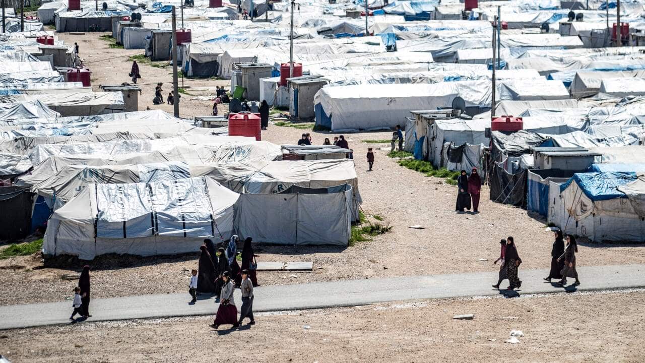 Tents and people at the al-Roj camp in Syria.
