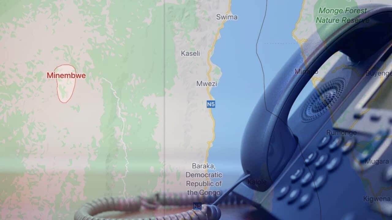 close up soft focus on telephone device at office desk for customer service support concept blended in with a map