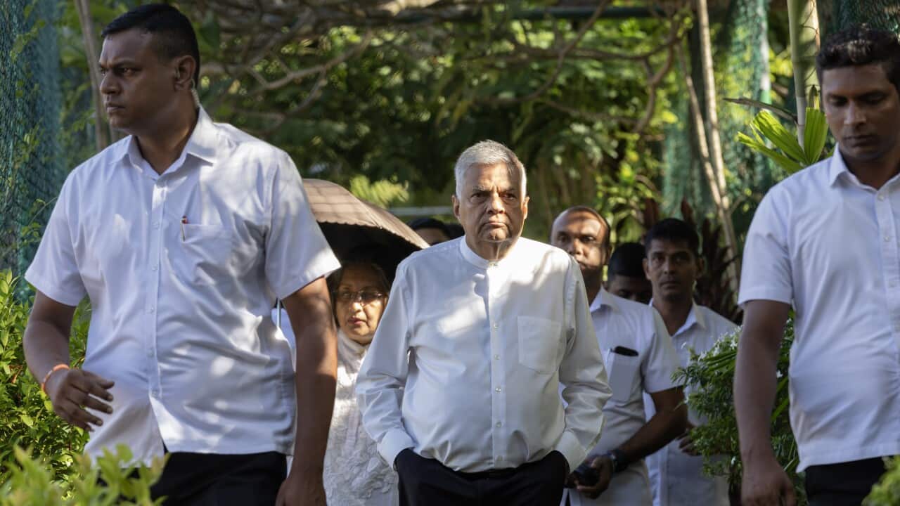 Ranil Wickremesinghe, departs after casting his ballot at a polling station