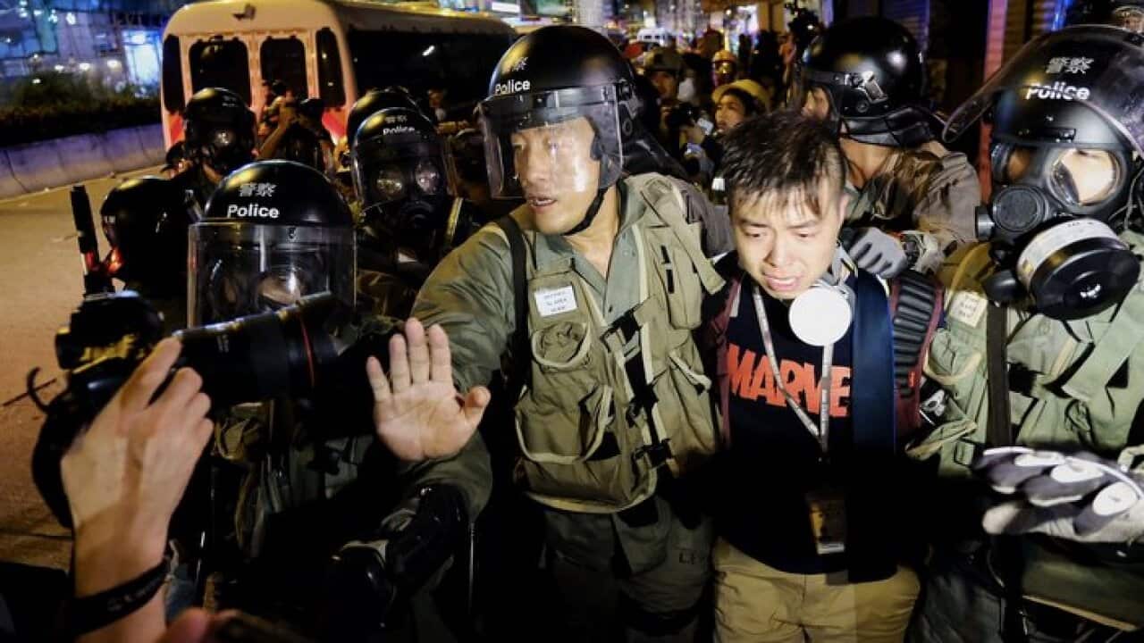 This reporter, from Ta Kung Pao, was helping another injured journalist in Sham Shui Po when he was accused of pushing away riot police.