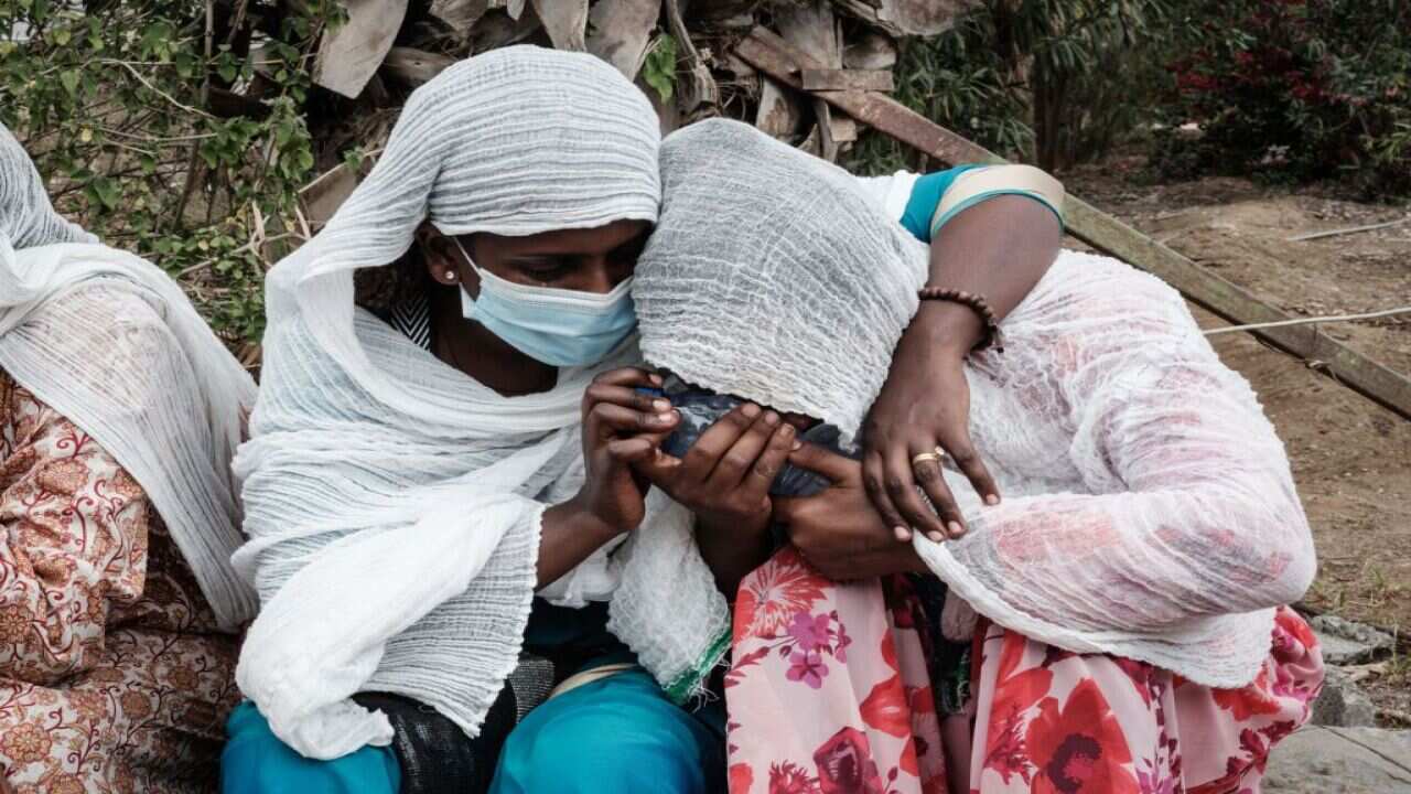 Relatives of Togoga residents, where an alleged airstrike hit a market, wait at the Ayder referral hospital in Mekele, 23 June, 2021.