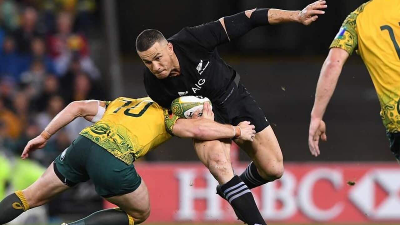 Sonny Bill Williams of the All Blacks dodges a tackle