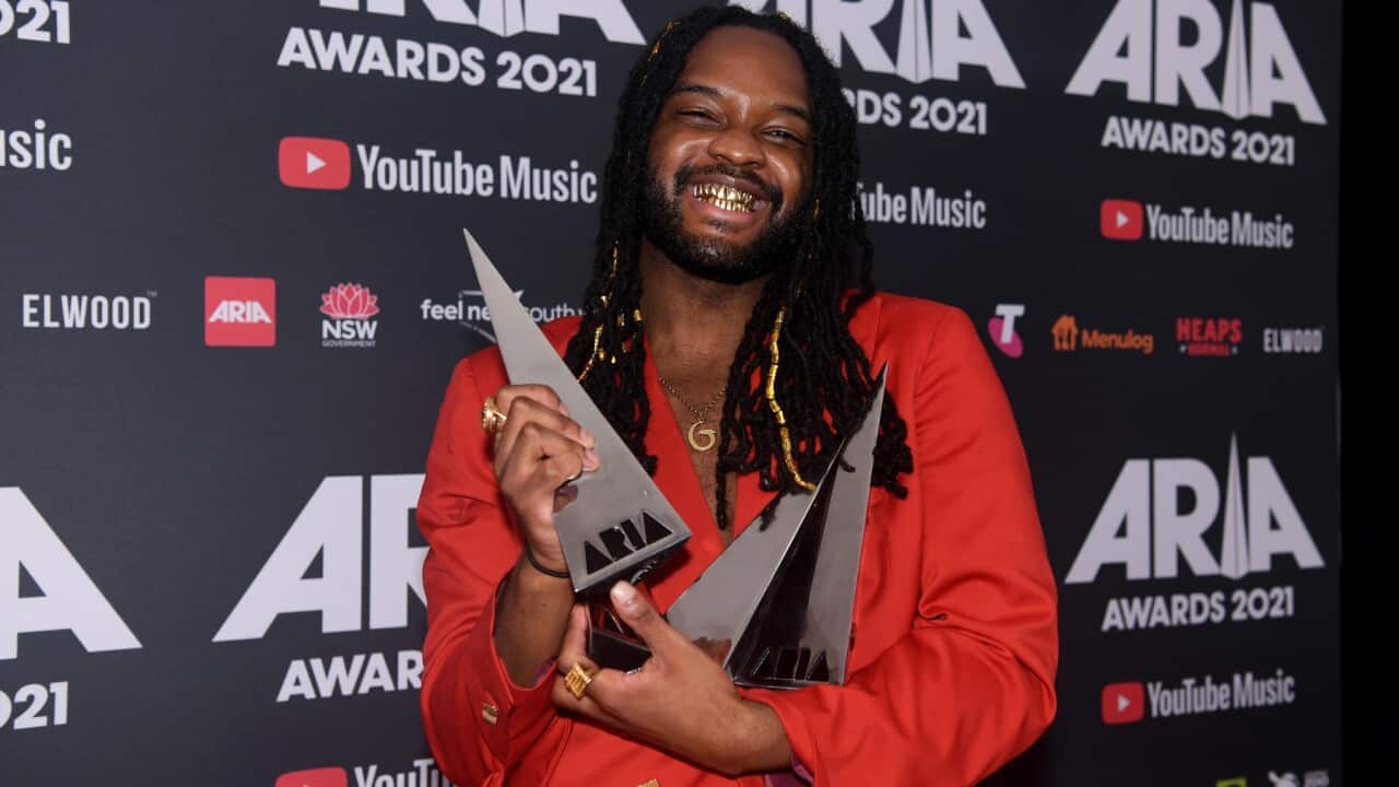 Genesis Owusu poses for a photograph after winning Album of the Year, Best Hip Hop Release, Best Independent Release and Best Cover Art at the 2021 ARIA Awards at Taronga Zoo, Sydney, Wednesday, November 24, 2021.