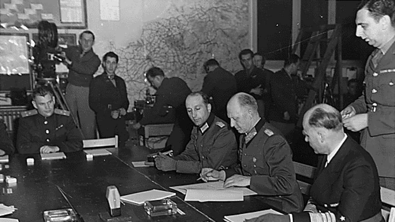 General Alfred Jodl signing the capitulation papers of unconditional surrender in Reims