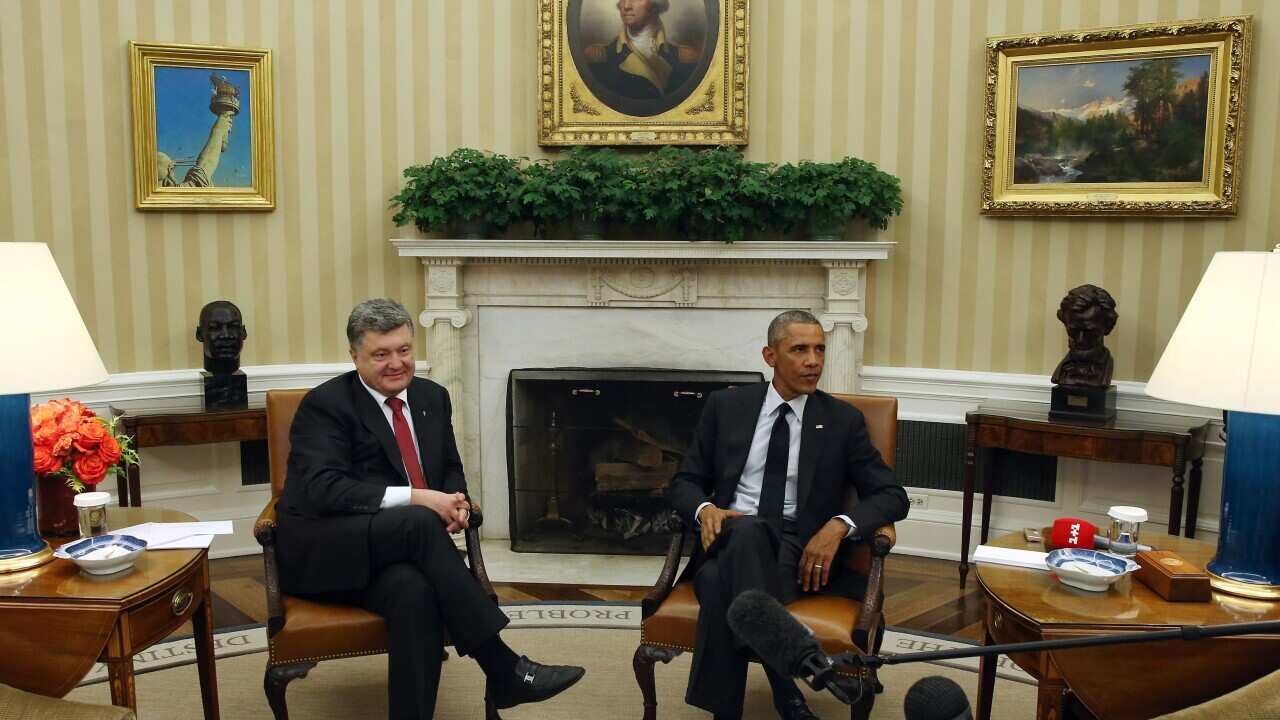 U.S. President Barack Obama (R) meets with Ukraine President Petro Poroshenko in the Oval Office at the White House, September 18