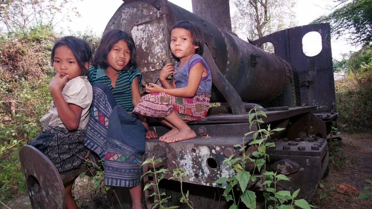 Lao children play on a rusting French locomotive, Khon Island, Laos (AAP Image-AP Photo-David Longstreath)