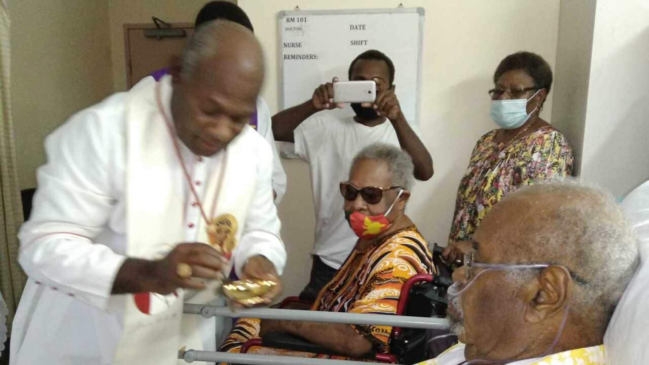 Cardinal Sir John Ribat at Sir Michael's bedside yesterday.