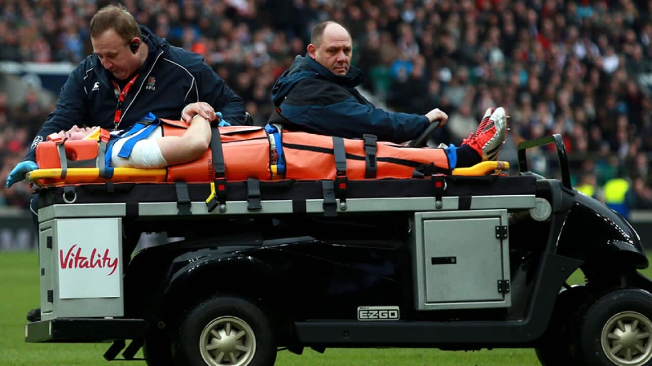 England's Mike Brown is stretchered off the field