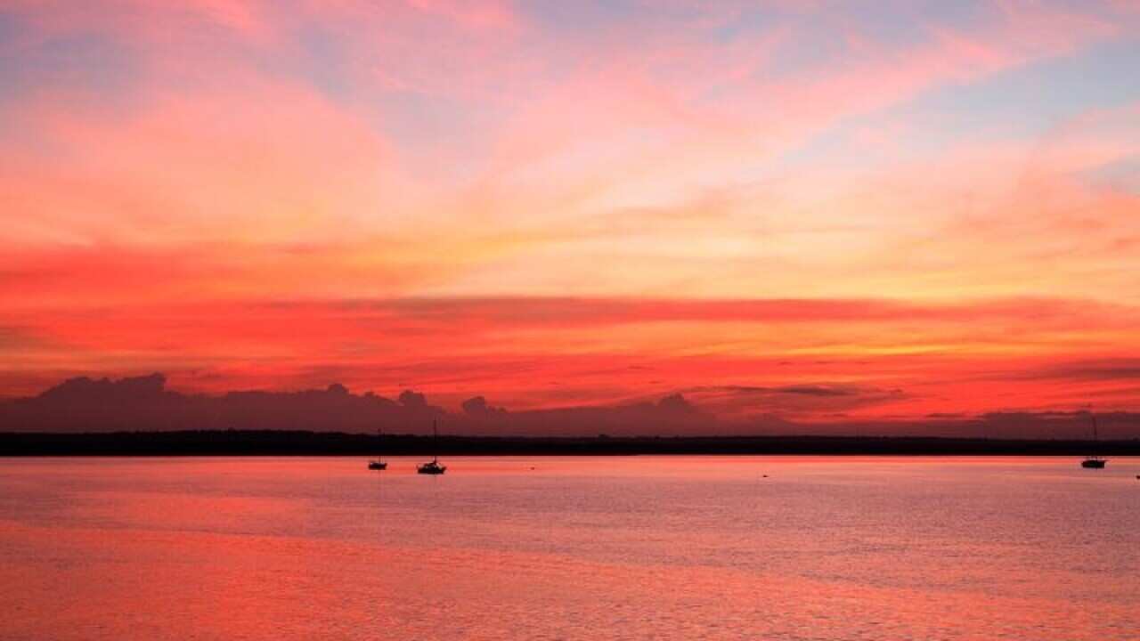 l view at sunrise from Stokes Hill Wharf in Darwin,