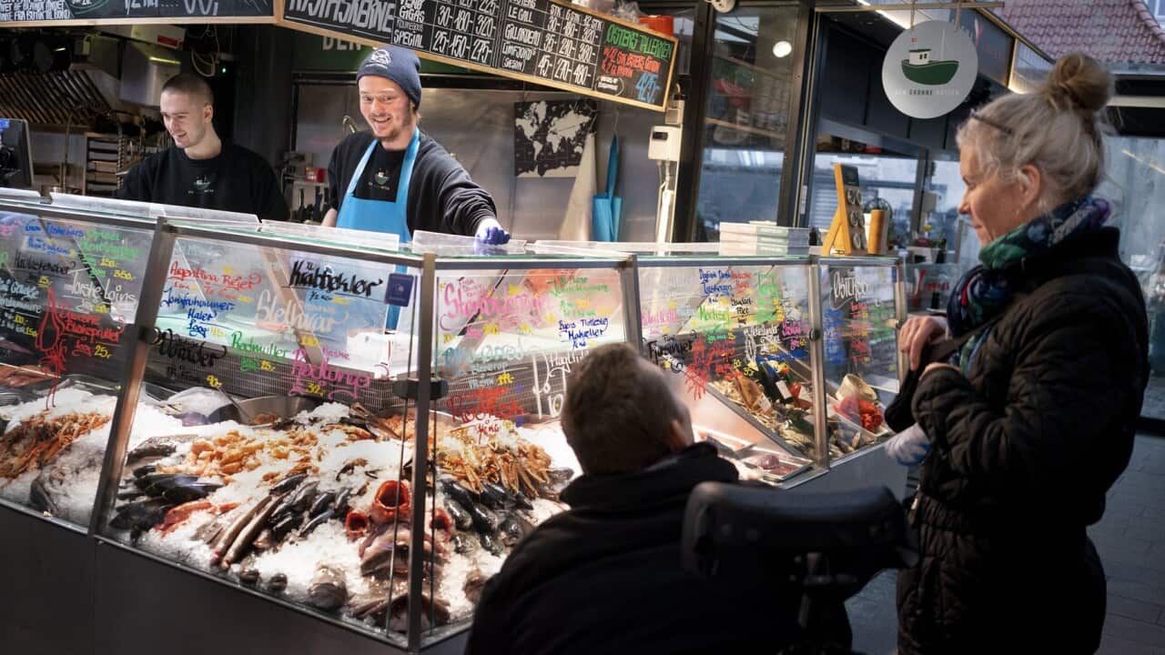 Shoppers in Denmark where most health measures are dropped