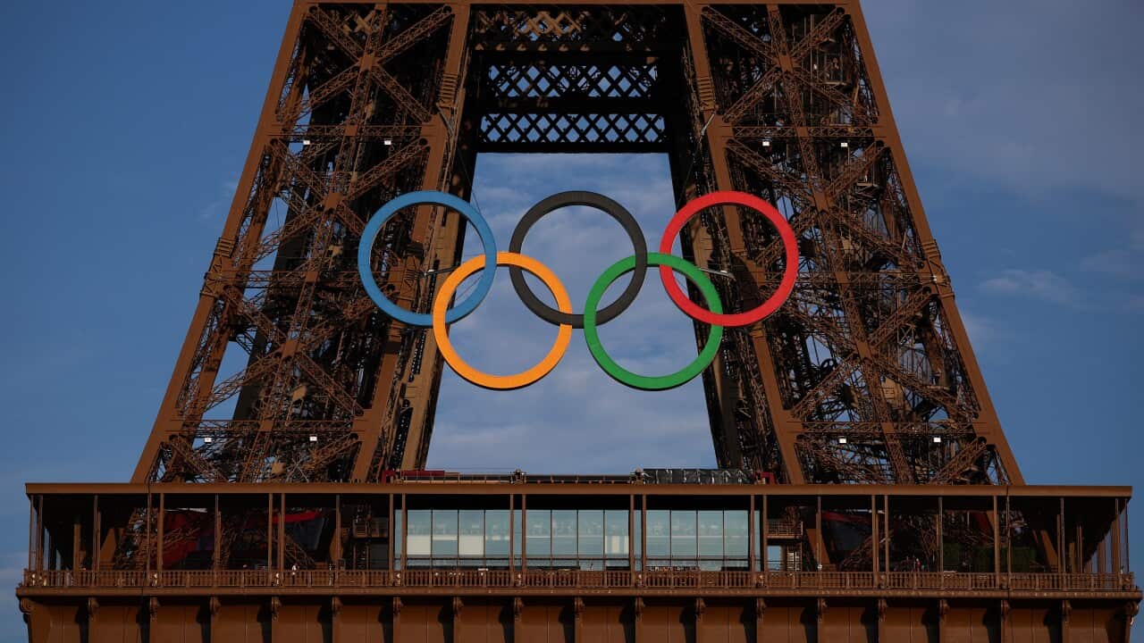 The Olympic rings are displayed on the Eiffel tower in Paris