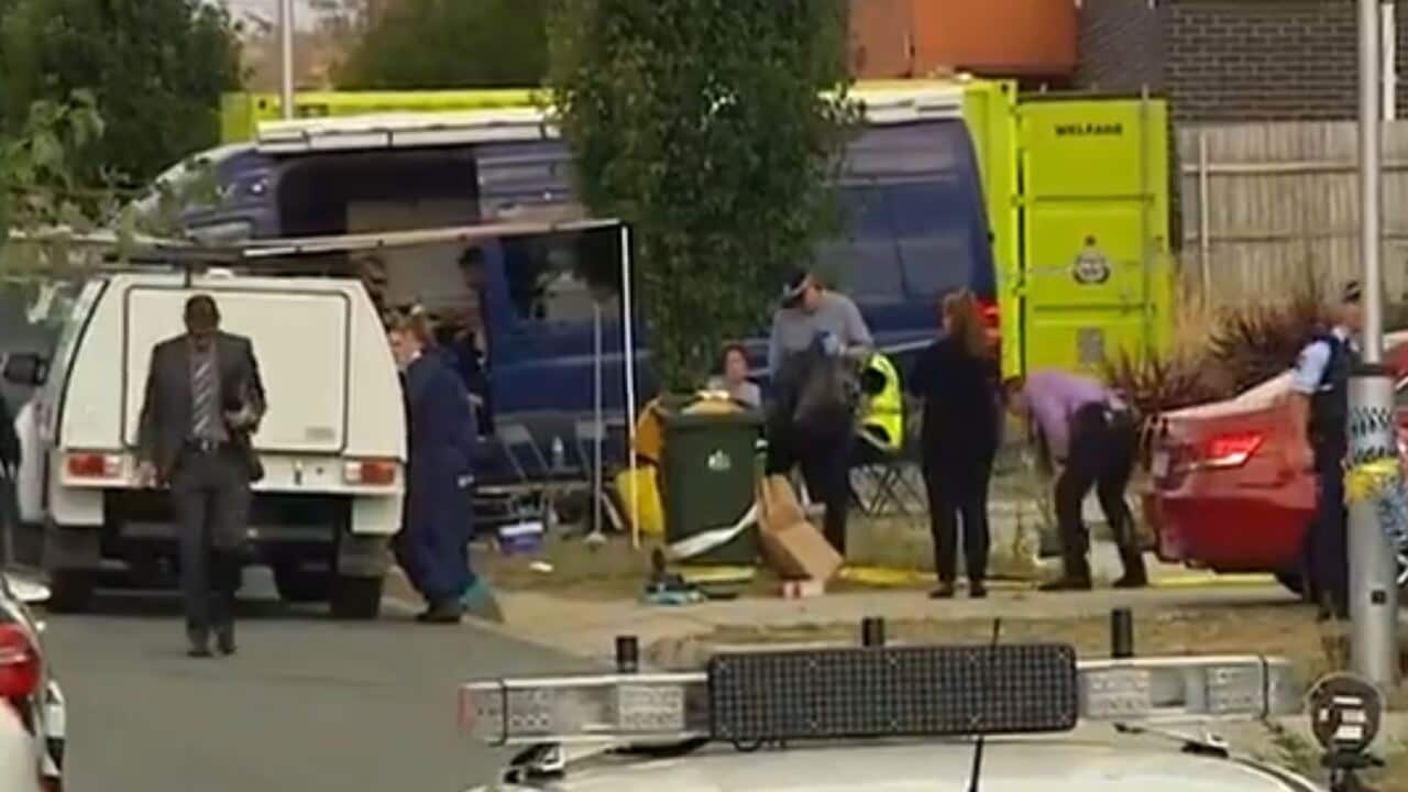The smoke blanketing the area where a house fire broke in Canberra, killing three people.