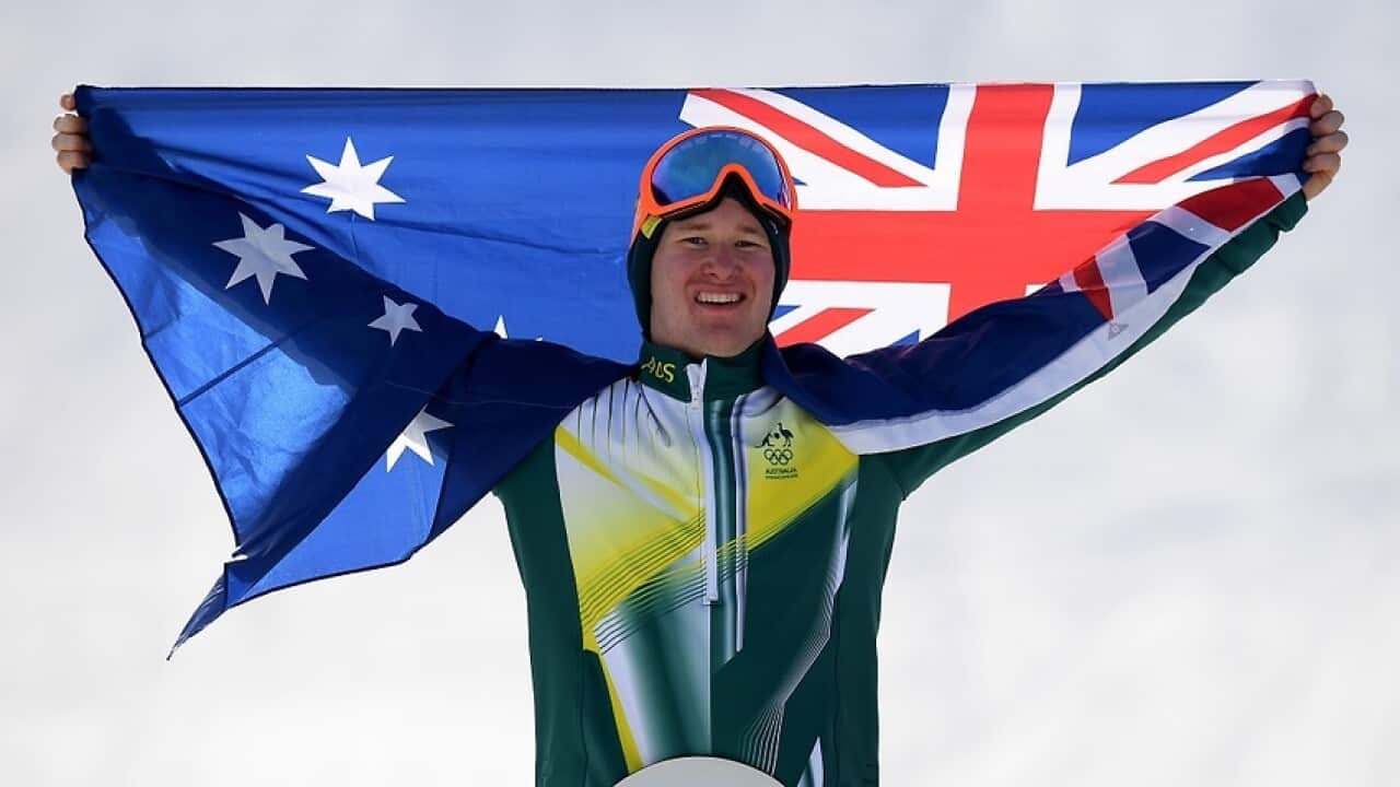 Jarryd Hughes of Australia on the podium after winning the silver medal in Men's Snowboard Cross.
