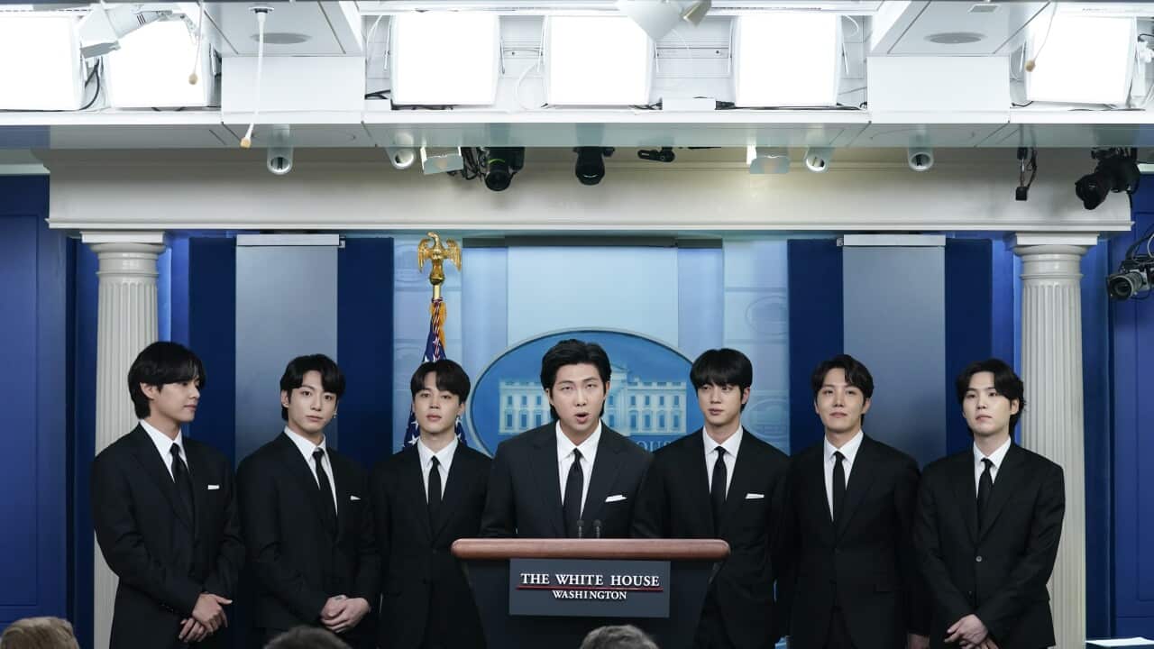 Members of the K-pop supergroup BTS join White House press secretary Karine Jean-Pierre during the daily briefing at the White House, Tuesday, May 31, 2022, in Washington. (AP Photo/Evan Vucci)