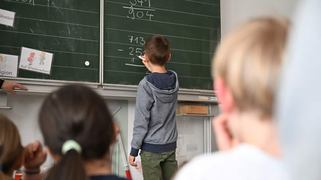 Children work on maths problems in a classroom. (Getty)