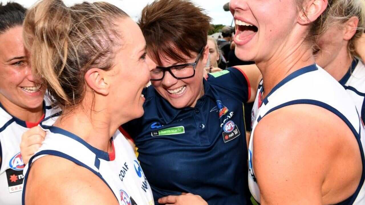 Bec Goddard (centre)