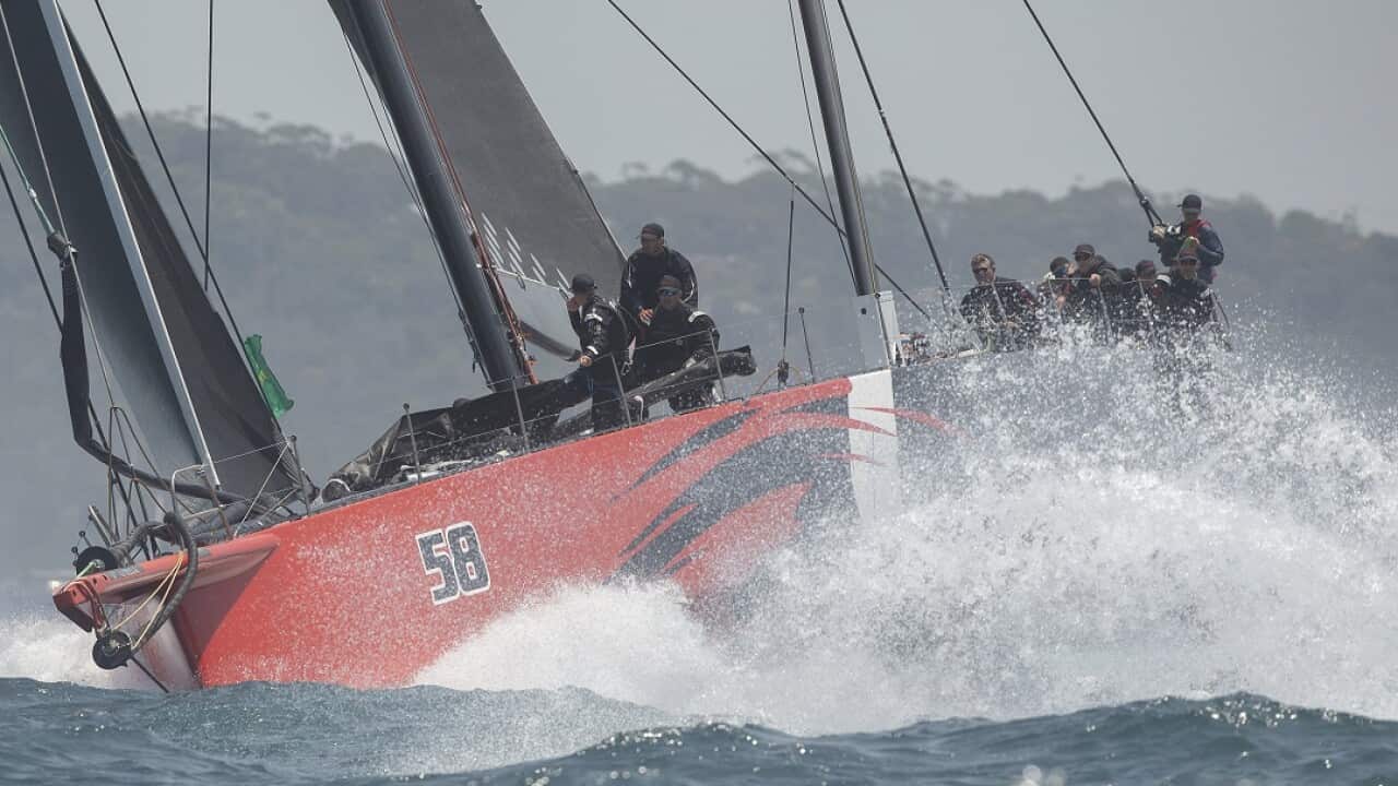 Comanche leaves the Sydney Heads during the start of the Sydney Hobart yacht race on Sydney Harbour, Thursday, Dec. 26, 2019. (AP Photo/Steve Chirsto)