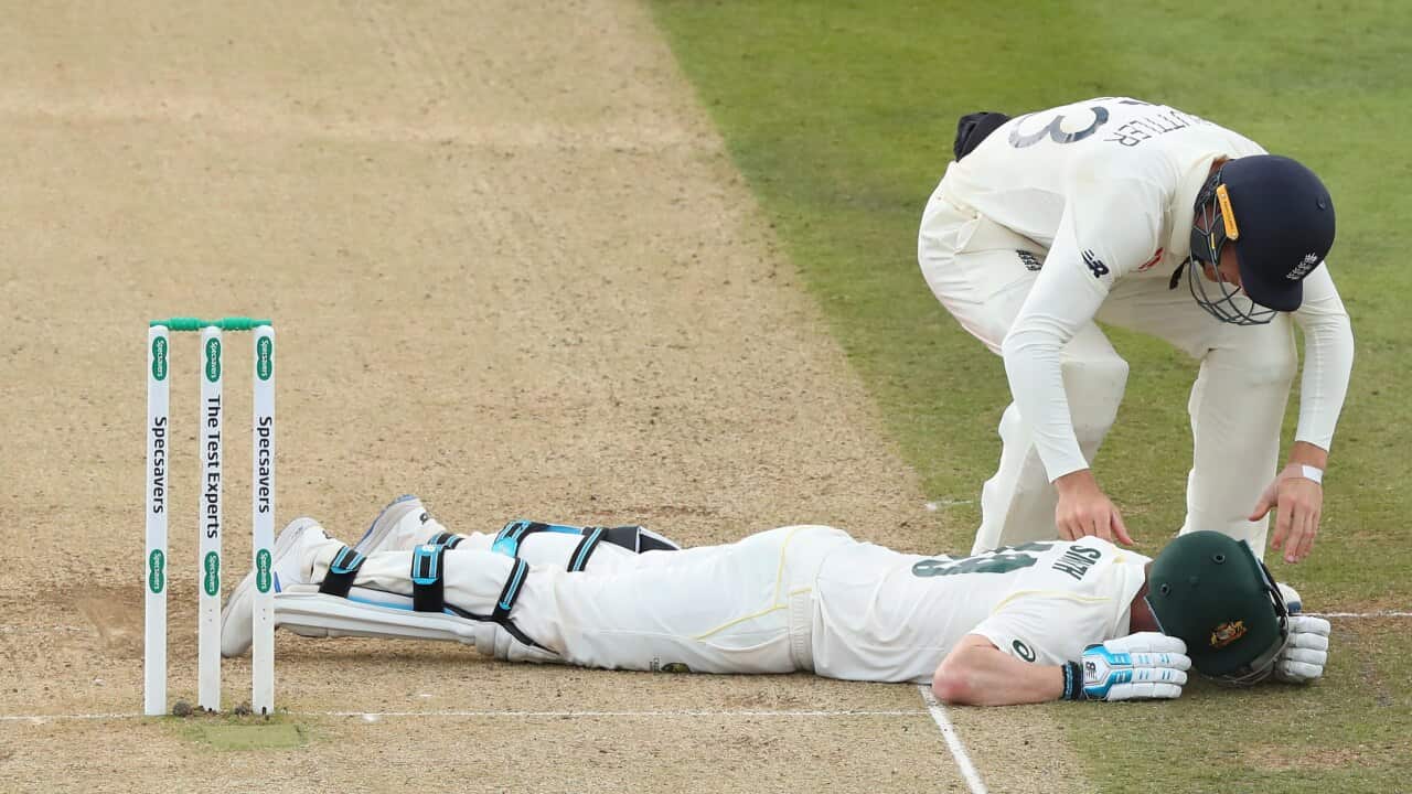 Jos Buttler of England rushes to the aid of Steve Smith of Australia during the 2nd Specsavers Ashes Test Match, at Lords Cricket Ground, London, England on August 17, 2019.(Photo by ESPA/Cal Sport Media/Sipa USA).