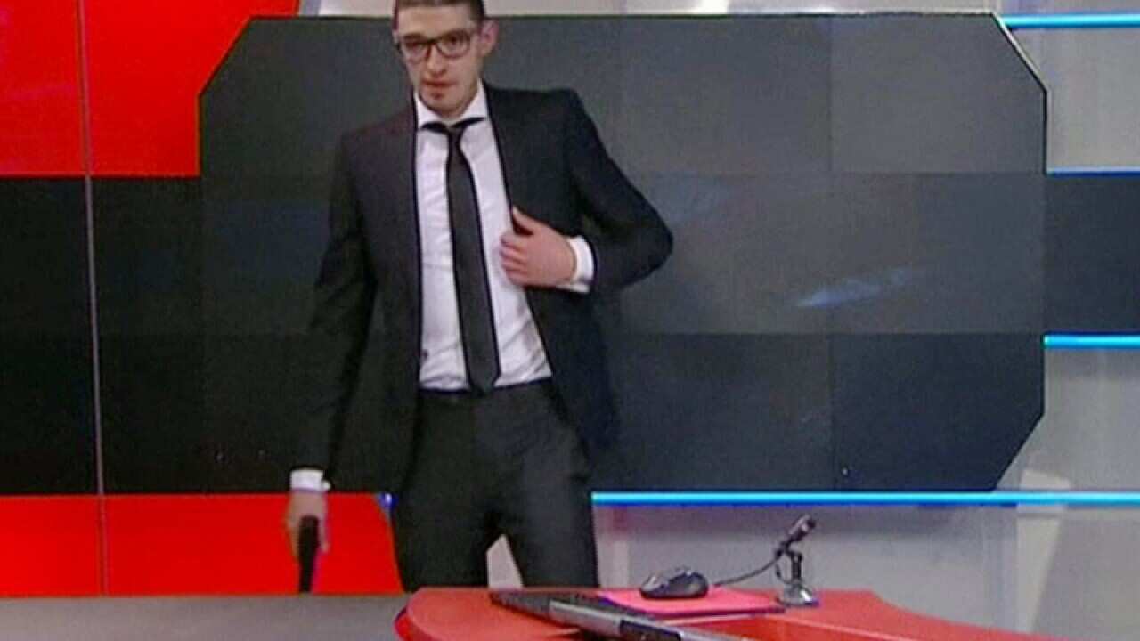 A man armed with a gun at Dutch TV station NOS